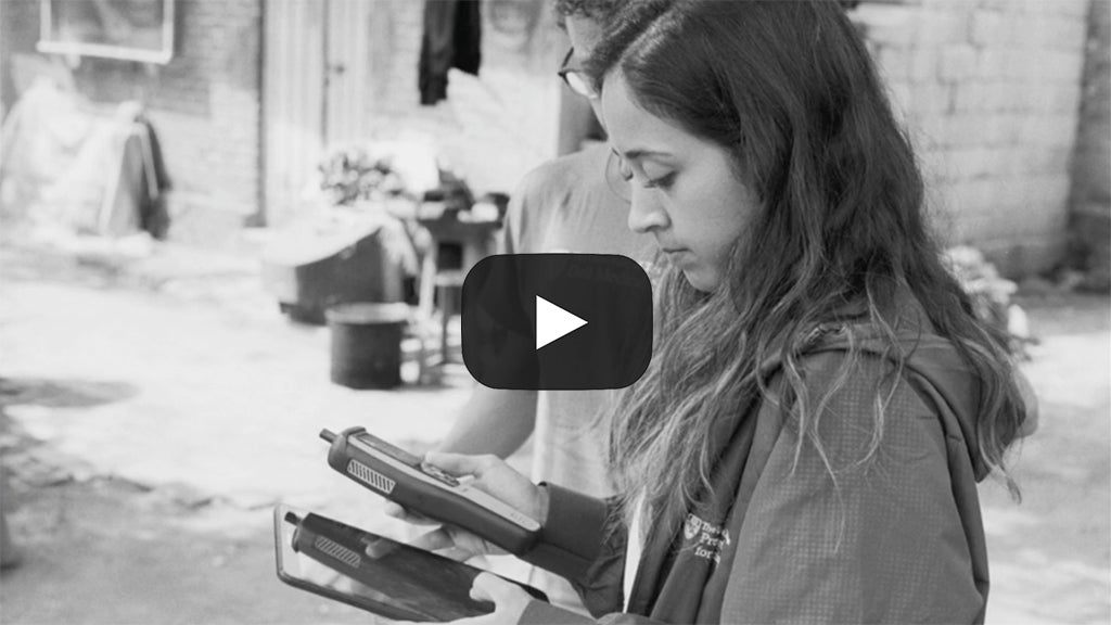 A President's Award for Global Learning team member works on a handheld machine in Mexico.