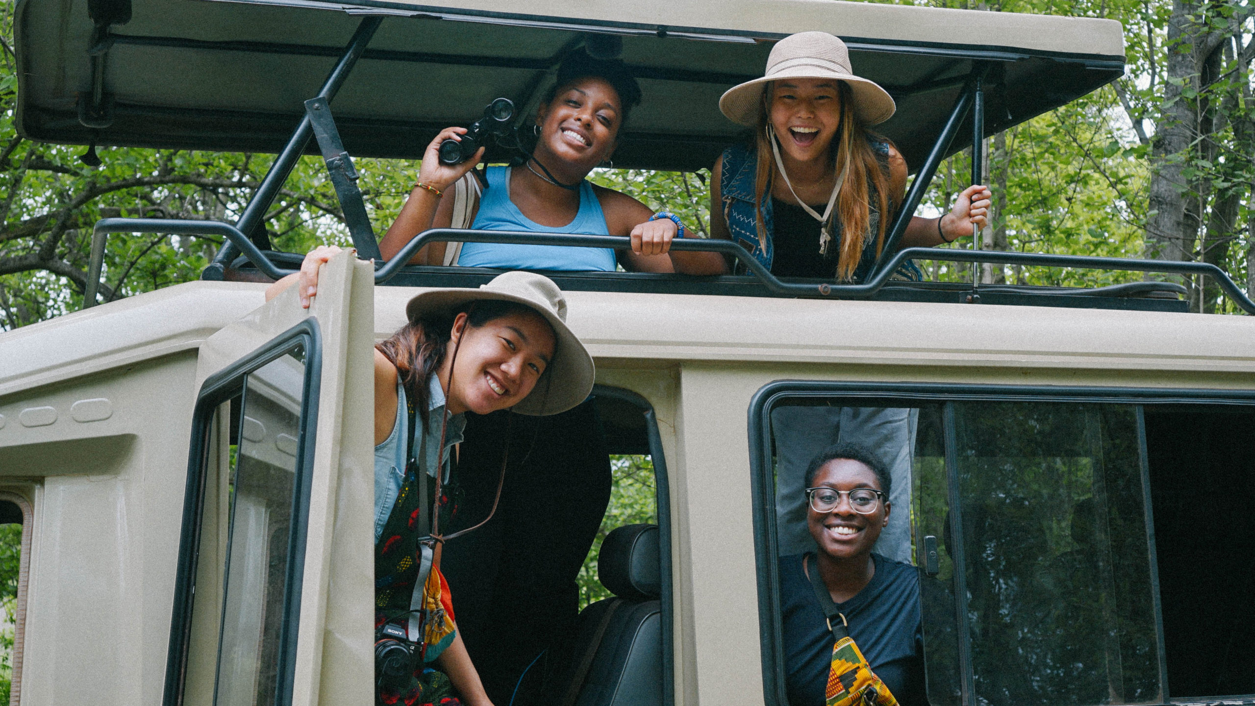 four President’s Award for Global Learning students posing for a photo in a truck in Ghana