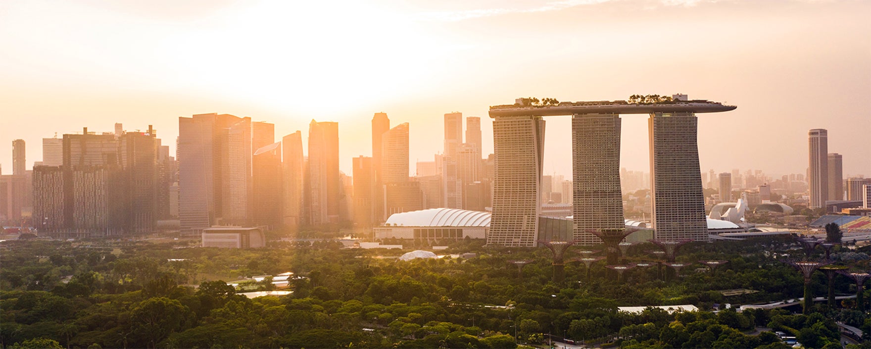 a view of singapore at sunset