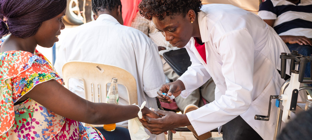 Woman donates her blood in a street point in Kampala, Uganda.