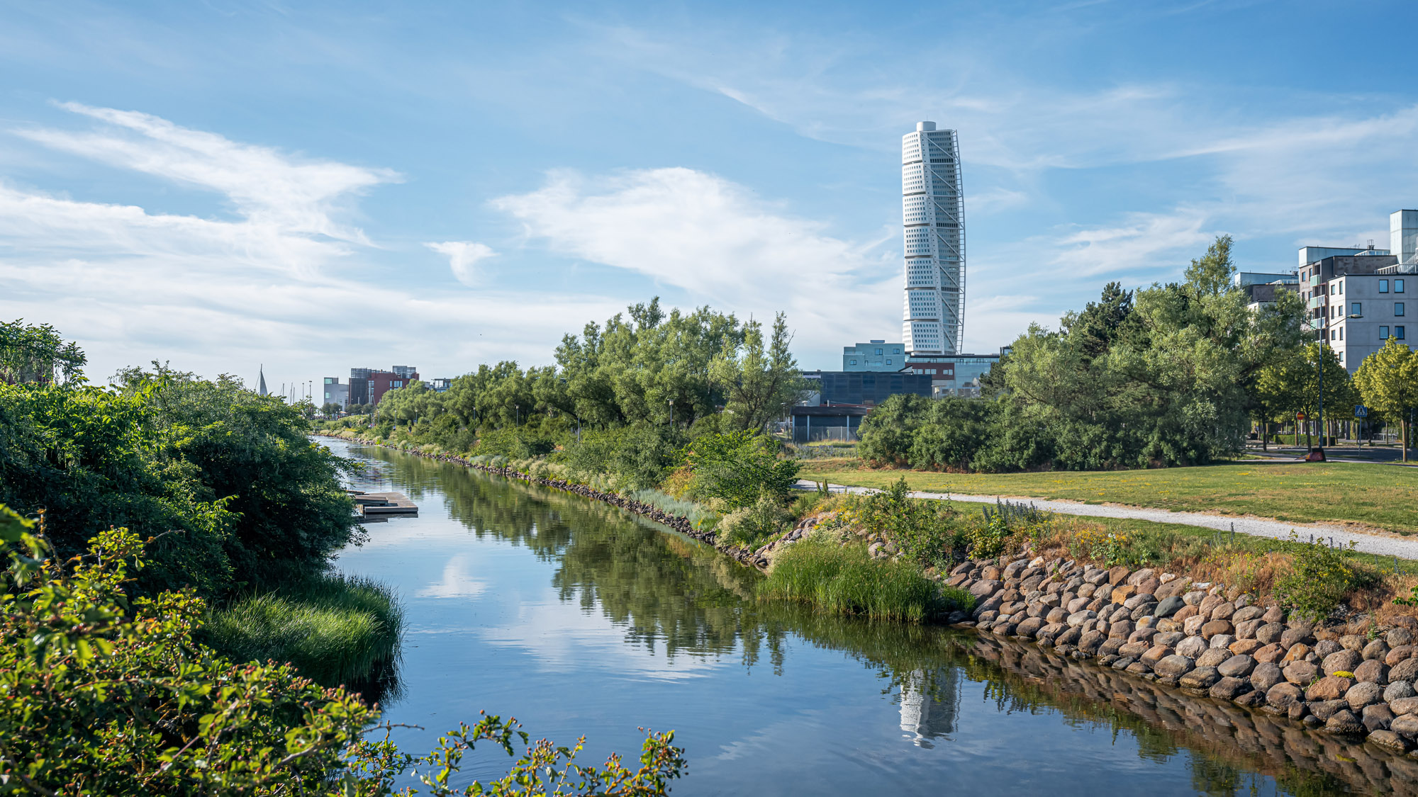 Malmo Skyline with canal and Turning Torso skyscraper building in Malmo, Sweden.